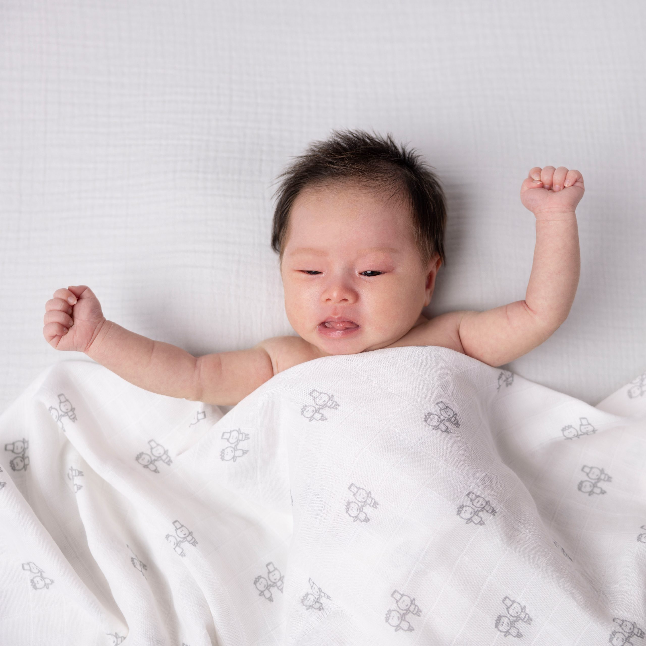 Why won’t my newborn sleep? baby in kiki & Sebby muslin